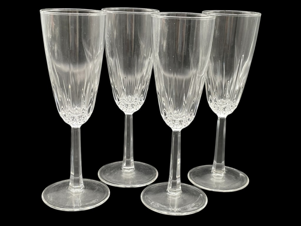 SET OF FOUR CUT GLASS CHAMPAGNE FLUTES 8": SET OF FOUR CUT GLASS CHAMPAGNE FLUTES 8" -Very good pre owned condition -Set of 4 glasses -Approx 8" tall -Beautiful set of four cut glass champagne flutes featuring elongated bowls with vertical cut