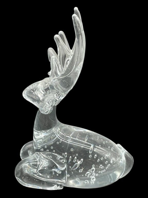 CRYSTAL GLASS REINDEER FIGURINE 6": CRYSTAL GLASS REINDEER FIGURINE 6" -Very good pre owned condition -Approx 6"h x 4"w -This is a captivating art glass sculpture of a deer, distinguished by its unique internal design. The piece depicts