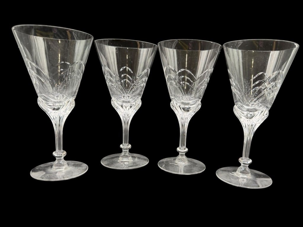 SET OF 4 CUT CRYSTAL WINE OR WATER GOBLETS: SET OF 4 CUT CRYSTAL WINE OR WATER GOBLETS -Elegant set of four cut crystal stemware glasses with faceted bowls, elongated stems, and decorative base detail. Each glass measures approximately 7" high