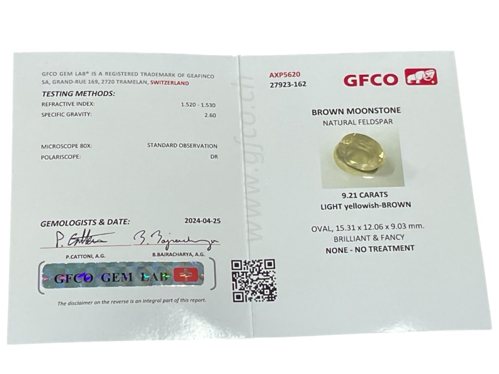 GFCO CERTIFIED 9.21 CARAT NATURAL BROWN MOONSTONE: GFCO CERTIFIED 9.21 CARAT NATURAL BROWN MOONSTONE – OVAL CUT, UNTREATED -This certified natural brown moonstone presents a soft, light yellowish-brown hue with excellent brilliance and fancy facetin