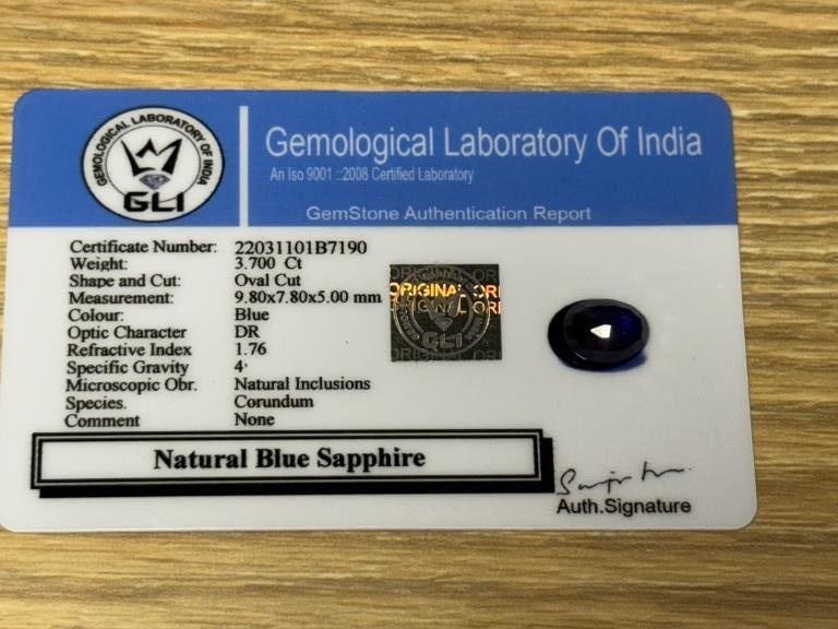 CERTIFIED NATURAL BLUE SAPPHIRE 3.70 CARAT OVAL CU: This natural blue sapphire weighs 3.70 carats and is certified by GLI. Cut in an oval mixed cut, the stone measures 9.80 × 7.80 × 5.00 mm and displays a rich, deep blue hue. The report notes no enha