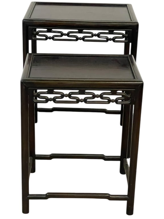 PAIR OF ASIAN-STYLE NESTING TABLES 26": PAIR OF ASIAN-STYLE NESTING TABLES WITH CARVED LINK MOTIF -Elegant pair of Asian-inspired nesting tables featuring a rich dark wood finish and beautifully carved openwork link motif aprons. The clean