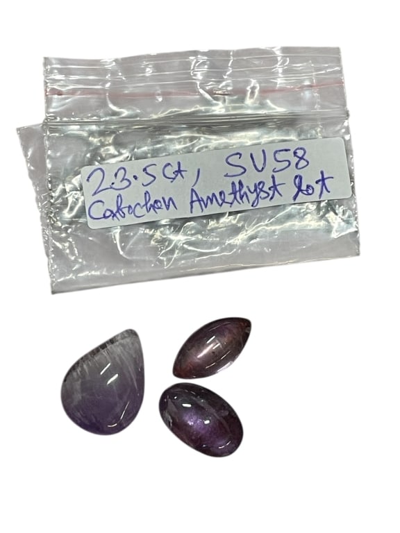 LOT OF THREE CABOCHON AMETHYST GEMSTONES 23.5CT: LOT OF THREE CABOCHON AMETHYST GEMSTONES – APPROX. 23.5 TOTAL CARATS -Attractive lot of three polished cabochon amethyst gemstones totaling approximately 23.5 carats, featuring mixed shapes includin