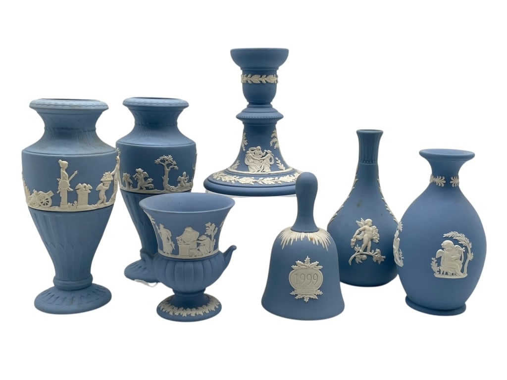 WEDGWOOD BLUE JASPERWARE GROUP 7 PIECES: WEDGWOOD BLUE JASPERWARE GROUP OF CLASSICAL VASES, URN, CANDLESTICK, AND COMMEMORATIVE BELL -Very good pre owned condition -7 pieces -Tallest approx 6" -Impressive Wedgwood blue jasperware assemblage