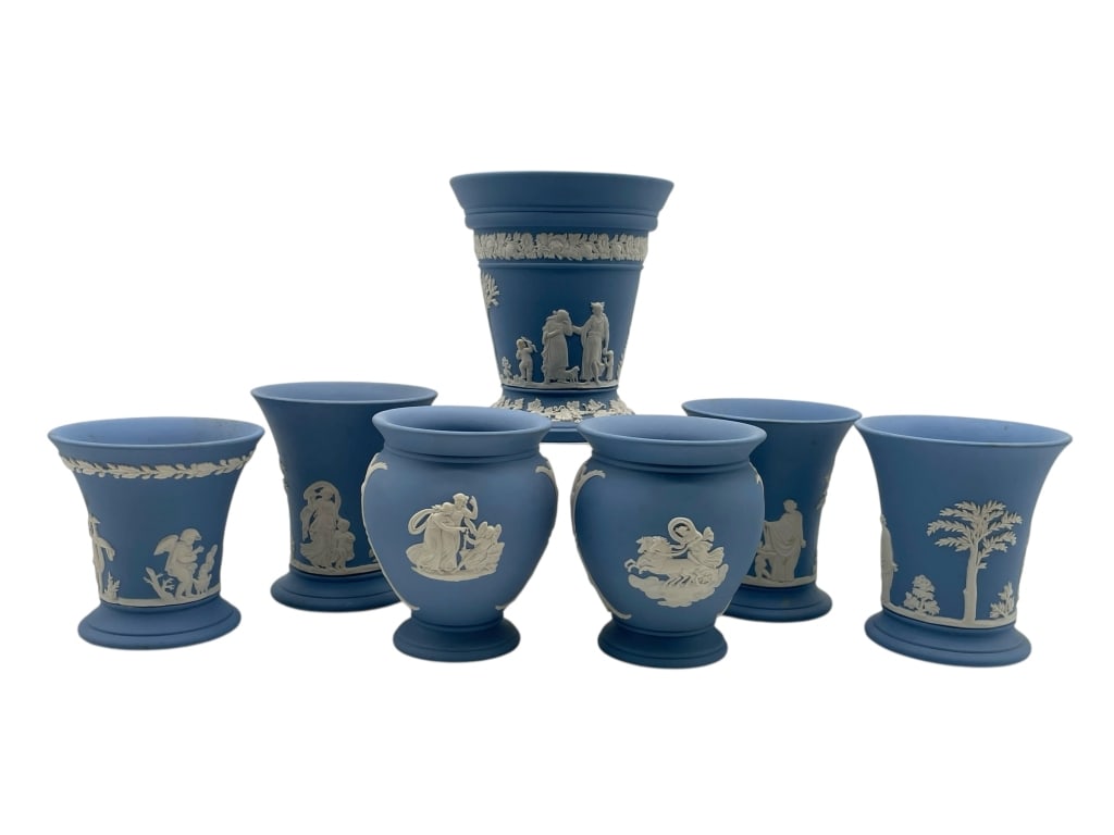 7 WEDGWOOD BLUE JASPERWARE VASES AND PLANTERS: WEDGWOOD BLUE JASPERWARE GROUP OF SEVEN CLASSICAL VASES AND PLANTERS -Very good pre owned condition -7 pieces -Tallest approx 5" -Exceptional vintage Wedgwood blue jasperware assemblage comprising sev
