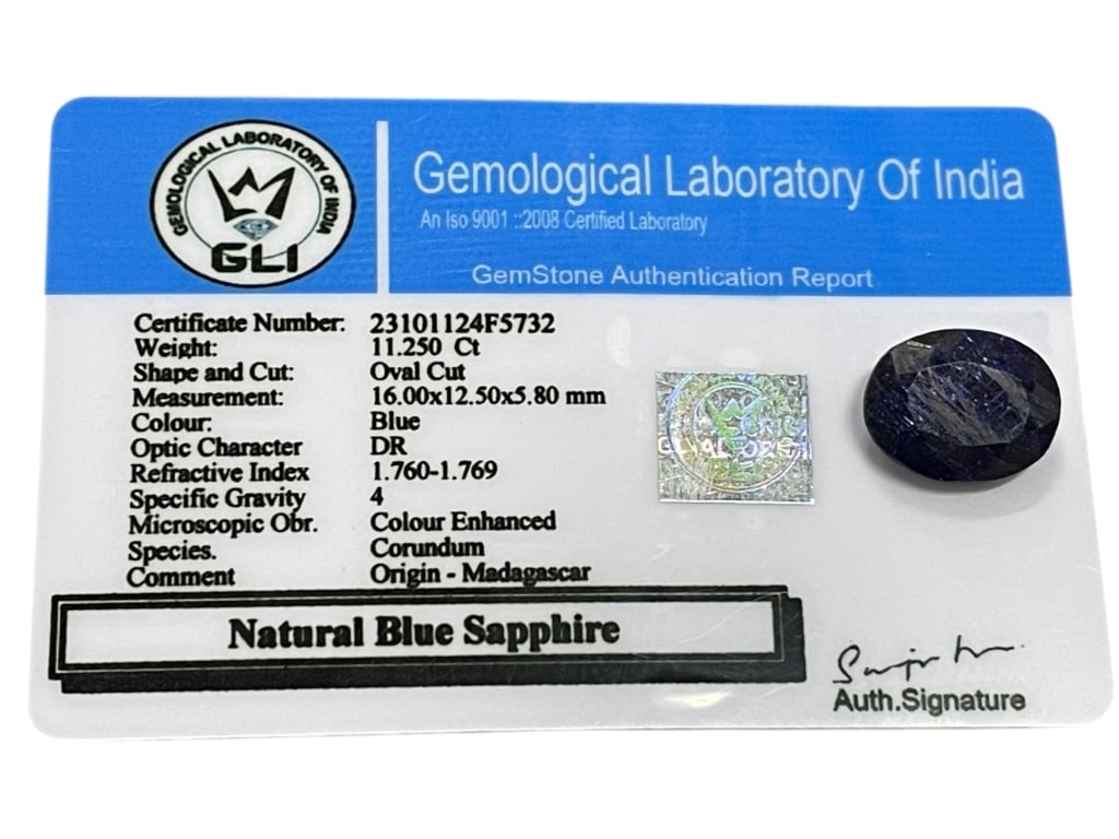 NATURAL BLUE SAPPHIRE 11.25 CT OVAL CUT, GLI CERT: NATURAL BLUE SAPPHIRE – 11.25 CT OVAL CUT, GLI CERTIFIED -Striking natural blue sapphire weighing approximately 11.25 carats, featuring an oval cut with rich deep blue coloration. The stone measures
