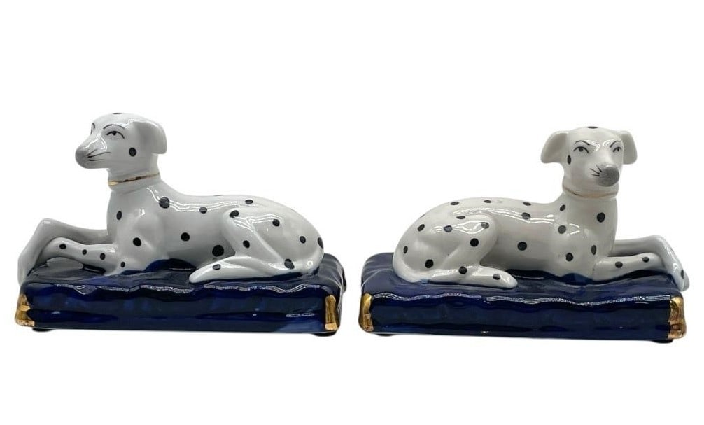 STAFFORDSHIRE STYLE DALMATIAN FIGURINES 5": STAFFORDSHIRE STYLE PORCELAIN DALMATIAN DOG FIGURINES -Very good pre owned condition -Approx 3.5"h x 5"w -Charming pair of porcelain Dalmatian-style dog figurines, each reclining gracefully on a rich