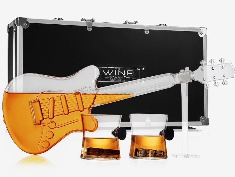 New in Case! Wine Savant Electric Guitar DecanterF: New in Case! Wine Savant Electric Guitar Decanter Unleash your inner rockstar with the Electric Guitar Decanter, a remarkable piece of drinkware that combines artistry, music, and fine spirits. Crafte