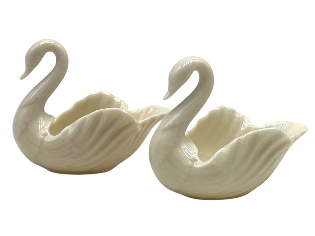PAIR OF LENOX PORCELAIN SWAN OPEN SALT CELLARS 2": PAIR OF LENOX PORCELAIN SWAN OPEN SALT CELLARS 2" -Very good pre owned condition -Approx 2" -Elegant pair of ivory porcelain swan-form open salt cellars or figural dishes by Lenox, beautifully modeled