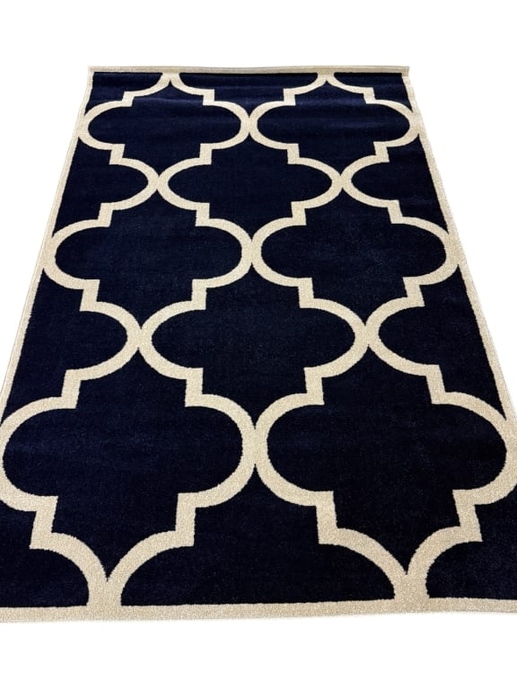UNIQUE LOOM NAVY & IVORY TRELLIS PATTERN RUG 5'x8': UNIQUE LOOM NAVY AND IVORY TRELLIS PATTERN AREA RUG 5' x 8' -Good pre owned condition -5' x 8' -This elegant area rug features a classic trellis pattern rendered in rich navy blue with crisp ivory det