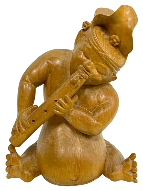 SCULPTURE OF CARVED WOODEN FIGURE PLAYING A FLUTE: SCULPTURE OF A CARVED WOODEN FIGURE PLAYING A FLUTE 12" -VERY GOOD PRE OWNED CONDITION -APPROX 9" X 4" X 12" -THIS EXPRESSIVE SCULPTURE FEATURES A FIGURE WITH A ROUNDED FORM, CLOSED EYES, AND A POINTE