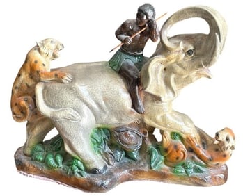FIGURAL SCULPTURE OF MAN ON ELEPHANT 17"