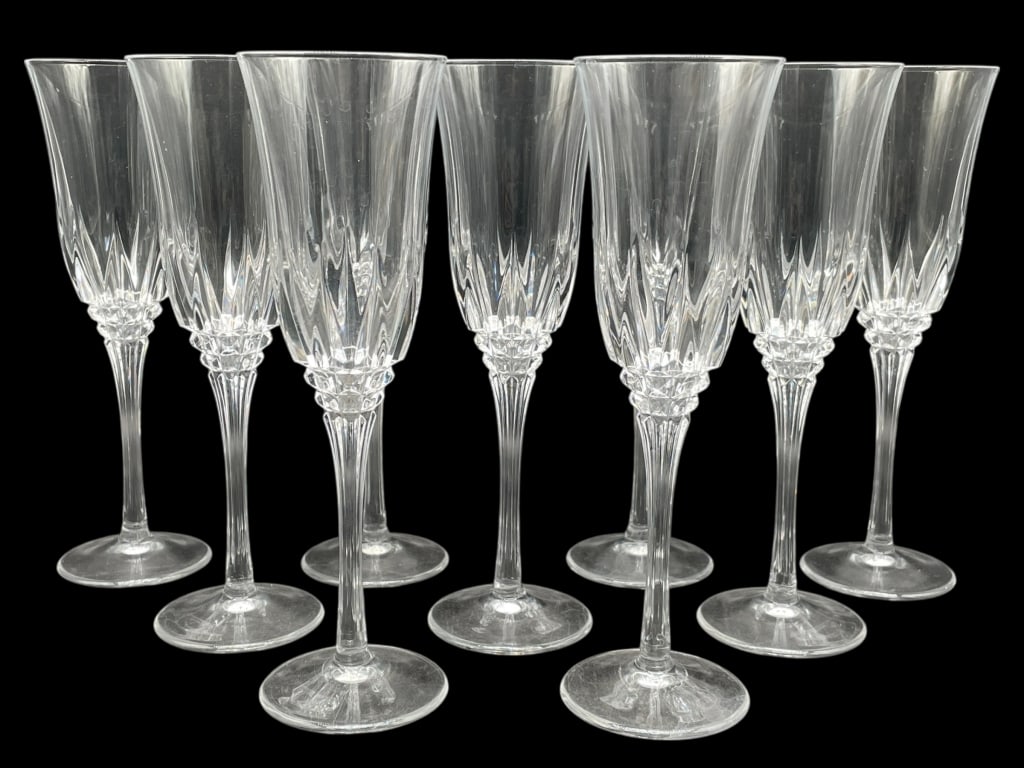 SET OF 9 CUT GLASS CHAMPAGNE FLUTES: SET OF 9 CUT GLASS CHAMPAGNE FLUTES -Very good pre owned condition -9 glasses -Approx 8.5"h x 2.5"w -Elegant set of nine matching cut glass champagne flutes featuring tall, tapered bowls with vertical