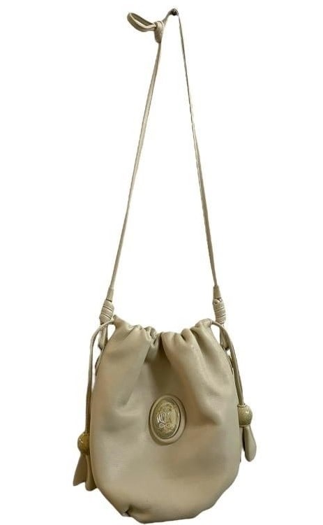 LLADRO CREAM LEATHER BUCKET BAG: LLADRO CREAM LEATHER BUCKET BAG -GOOD PRE OWNED CONDITION, SOME GENERAL WEAR -LLADRO CARD -BAG APPROX 8" X 7", STRAP APPROX 15" By bidding on this item, you have read, understand, and agree to the ter