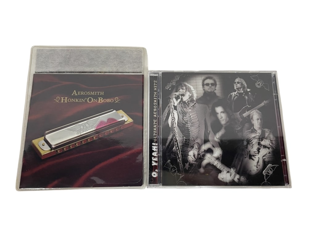 AEROSMITH CD LOT: AEROSMITH CD LOT – “HONKIN’ ON BOBO” & “ULTIMATE AEROSMITH HITS” -This two-album Aerosmith collection includes Honkin’ On Bobo, the band’s gritty and soulful return to their bl