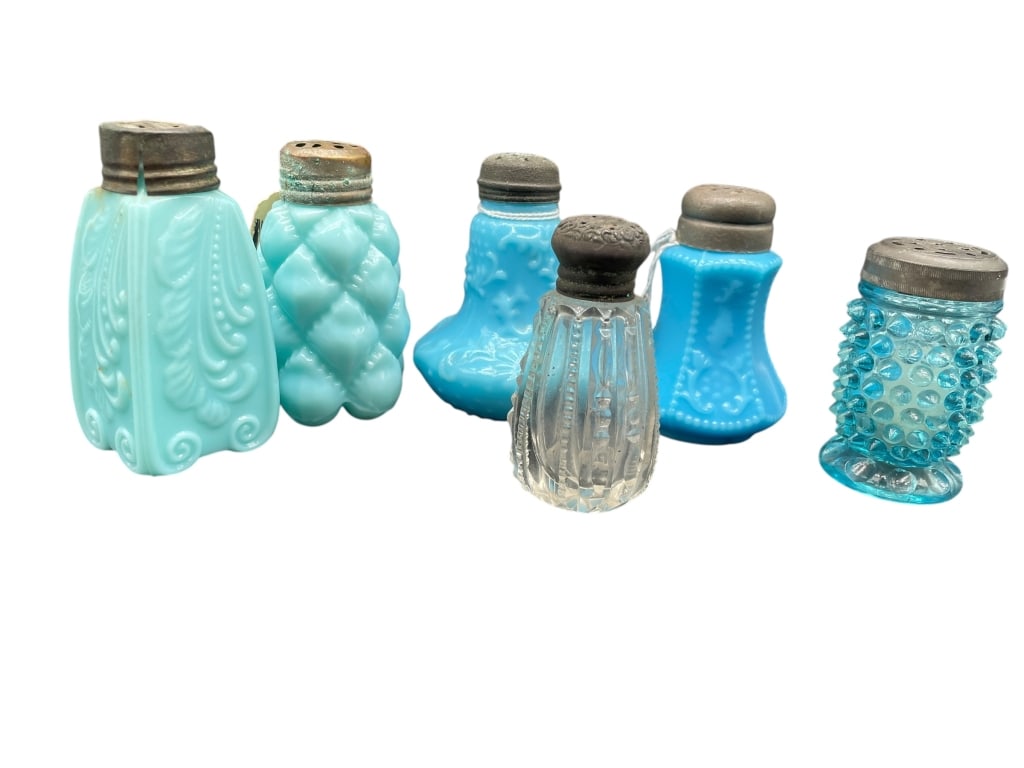 GROUP OF VINTAGE BLUE GLASS SALT & PEPPER SHAKERS: GROUP OF VINTAGE BLUE GLASS SALT AND PEPPER SHAKERSThis group includes several vintage salt and pepper shakers in varying shades of blue glass, including milk glass, pressed glass, and textured design