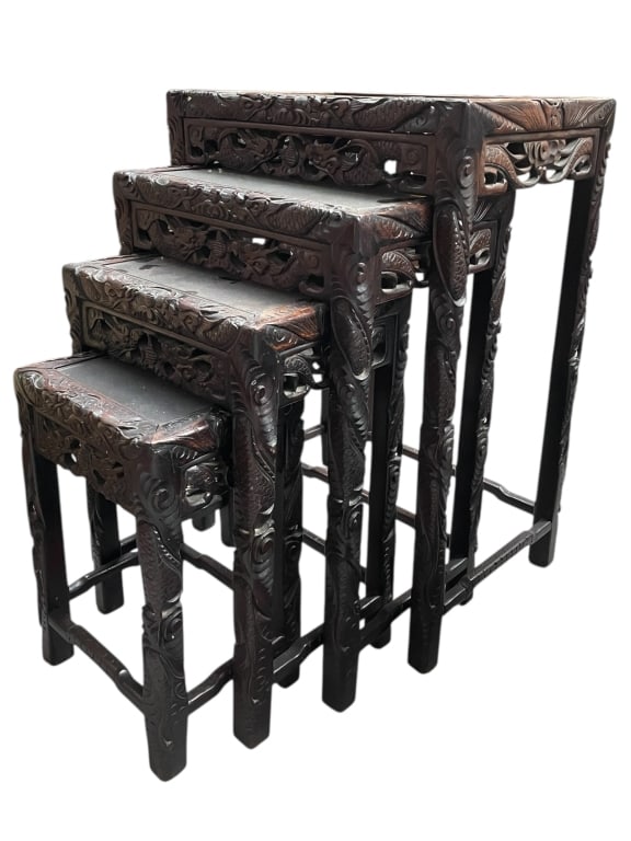 SET OF FOUR CARVED ASIAN-STYLE NESTING TABLES 28": SET OF FOUR CARVED ASIAN-STYLE NESTING TABLES 28" -Very good pre owned condition -All have glass insert top except for the tallest one -Tallest approx 28"h x 19"w x 14"d -This striking set of four Asi
