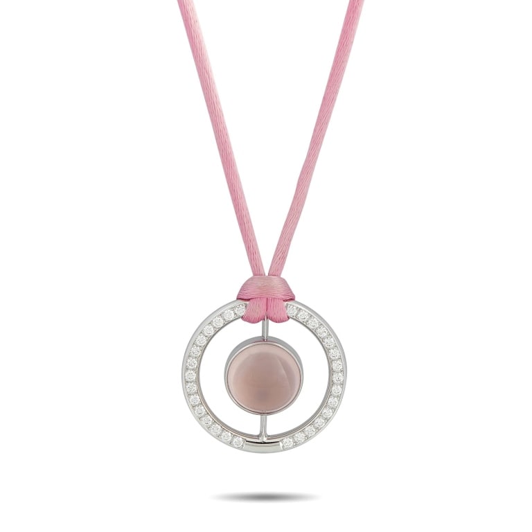 BUCHERER 18K WHITE GOLD 1.11CT DIAMOND AND ROSE QU: This Bucherer necklace is simply unforgettable. Perfect for anyone who loves the color pink, a stunning Rose Quartz gemstone is suspended at the center of a circular 18K White Gold pendant. The pendan