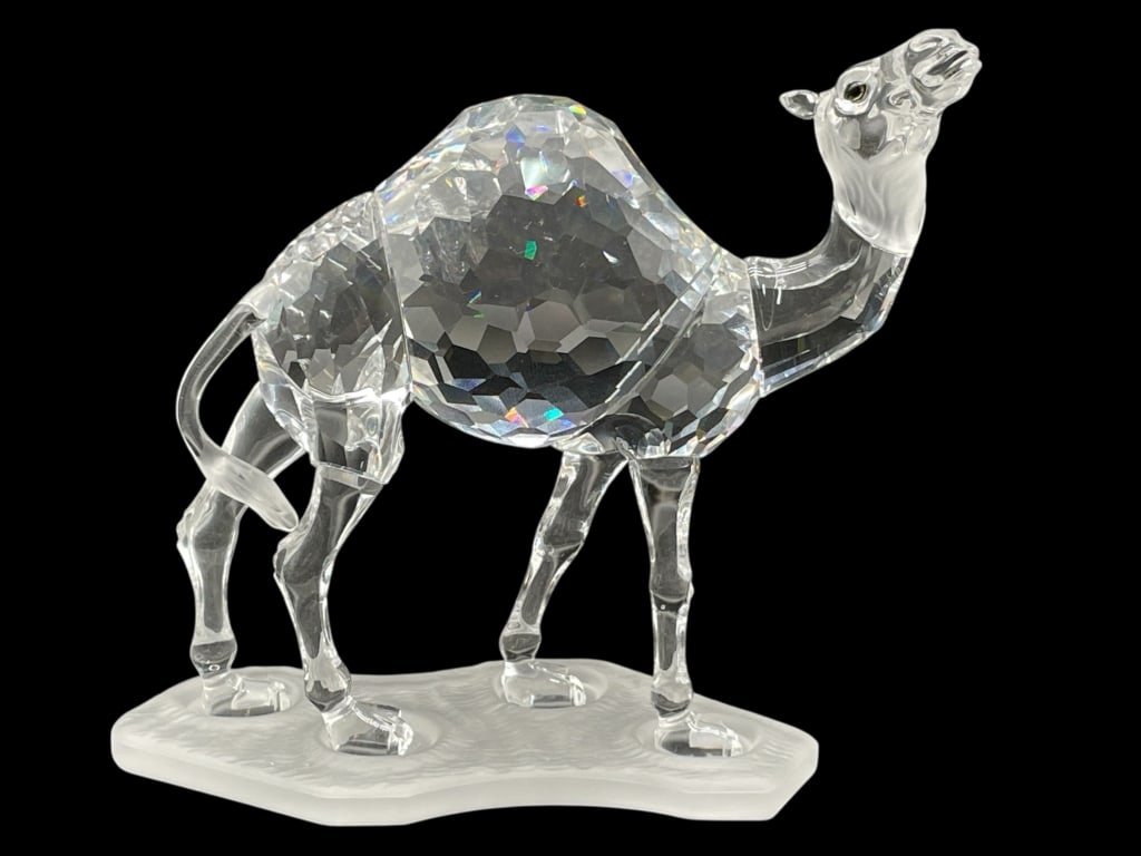 SWAROVSKI CRYSTAL CAMEL FIGURINE FROSTED BASE 5.5": SWAROVSKI CRYSTAL CAMEL FIGURINE W FROSTED BASE -Very good pre owned condition -Approx 4.5"h x 5.5"w -Striking and highly collectible Swarovski faceted crystal camel figurine, masterfully crafted with