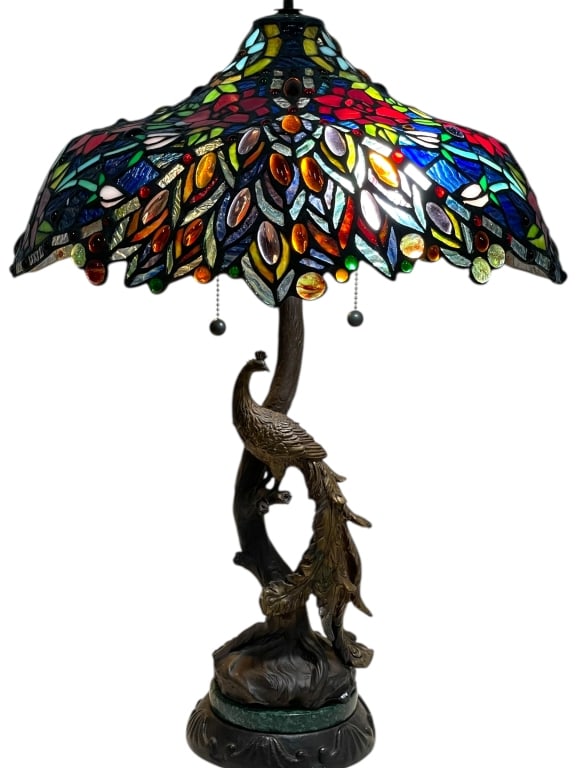 TIFFANY STYLE LEADED GLASS PEACOCK TABLE LAMP 24": TIFFANY STYLE LEADED GLASS PEACOCK TABLE LAMP 24" H W 18" SHADE -Exceptional Tiffany style leaded glass table lamp featuring a vibrant peacock motif shade with elongated feather forms, jewel cabochons