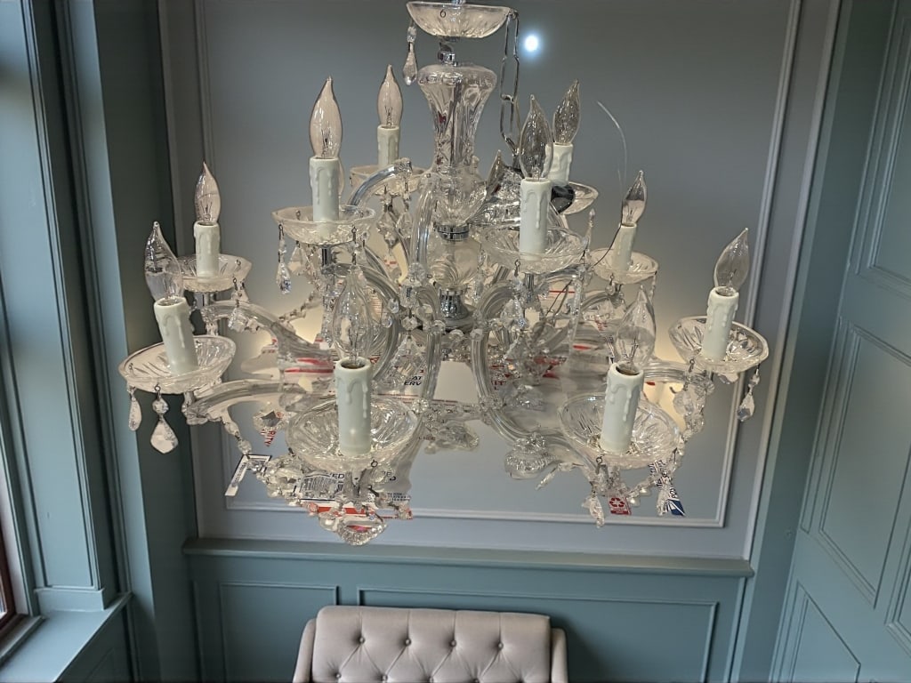 ELEGANT MULTI-ARM CRYSTAL CHANDELIER 26": ELEGANT MULTI-ARM CRYSTAL CHANDELIER WITH GLASS DROPS 18" H X 26" D -Elegant multi-arm crystal chandelier featuring numerous glass candle arms adorned with faceted crystal prisms and drops. This state
