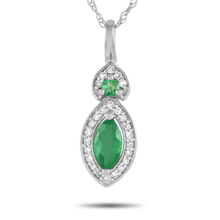 14K WHITE GOLD 0.07CT DIAMOND AND EME: This timeless necklace will add the perfect pop of color to any ensemble. Suspended from an 18 chain, youll find a sophisticated pendant measuring 0.75 long and 0.25 wide. It comes to life thanks to