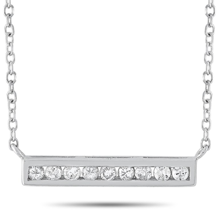 14K WHITE GOLD 0.10 CT DIAMOND PENDAN: This LB Exclusive necklace is made of 14K white gold and embellished with diamonds that amount to 0.10 carats. The necklace weighs 1.5 grams and boasts a 15 chain and a pendant that measures 0.80 in