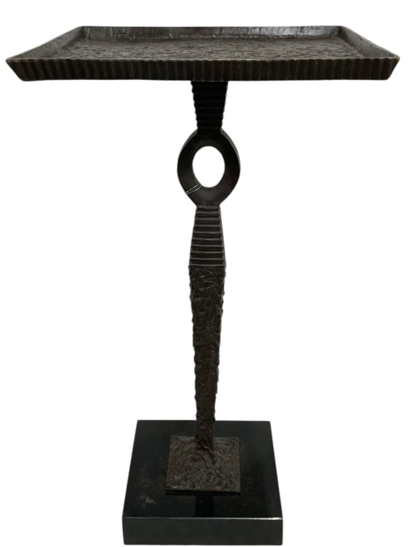 MANNER OF GIACOMETTI BRONZE & BLACK GRANITE TABLE: Striking modern cast bronze side table executed in the manner of Diego Giacometti, featuring rich naturalistic texturing and sculptural presence. The rectangular bronze top is accented with a raised f