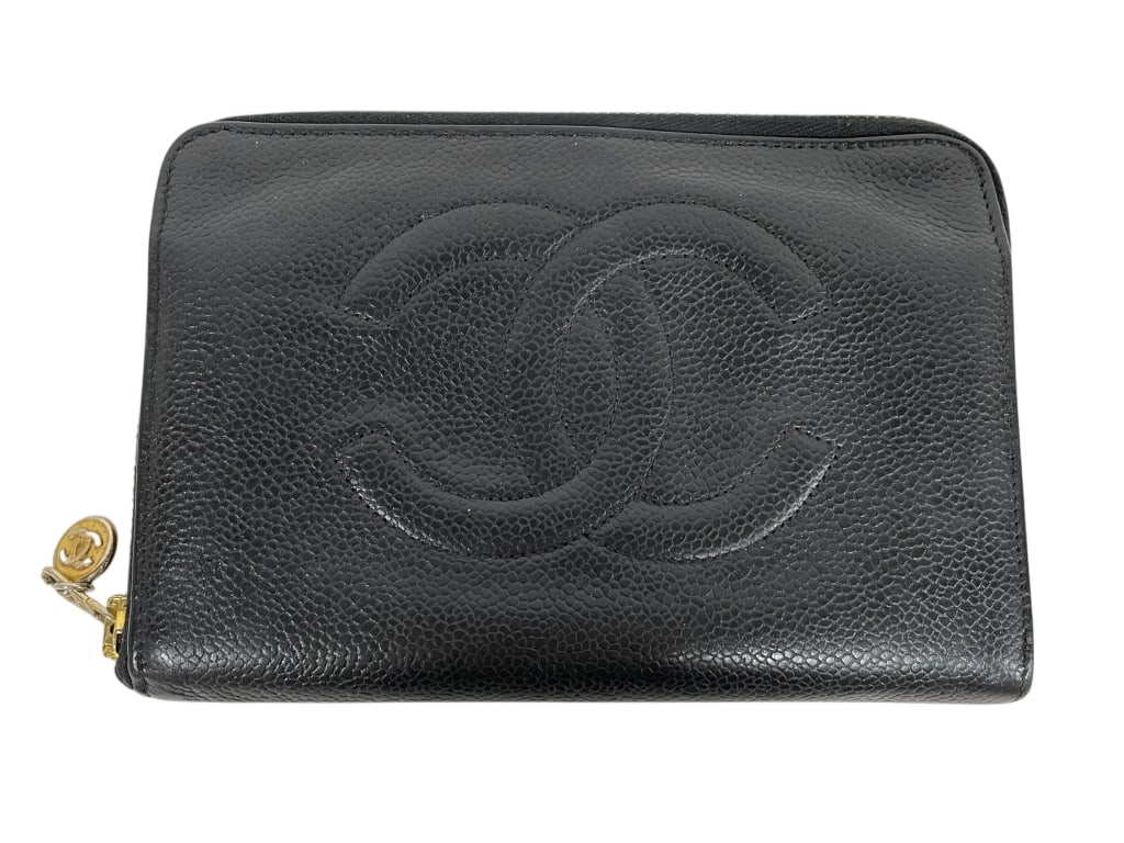 CHANEL BLACK CAVIAR LEATHER ZIP WALLET WITH CC LOG: CHANEL BLACK CAVIAR LEATHER ZIP WALLET WITH CC LOGO -Very good pre owned condition -Approx 7"l x 4.5"w -Classic Chanel navy caviar leather zip-around wallet featuring the iconic embossed interlocking