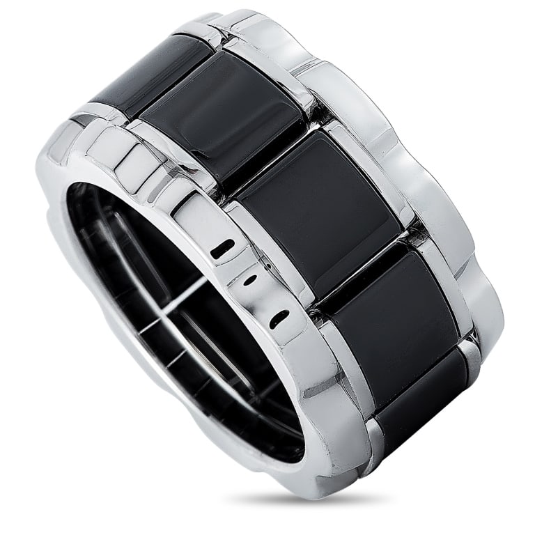 TAG HEUER STAINLESS STEEL AND CERAMIC BRACELET: RING SIZE: 5. This Tag Heuer ring is made out of stainless steel and black ceramic and embellished with a diamond stone that features grade H color and SI clarity and weighs approximately 0.007 carats