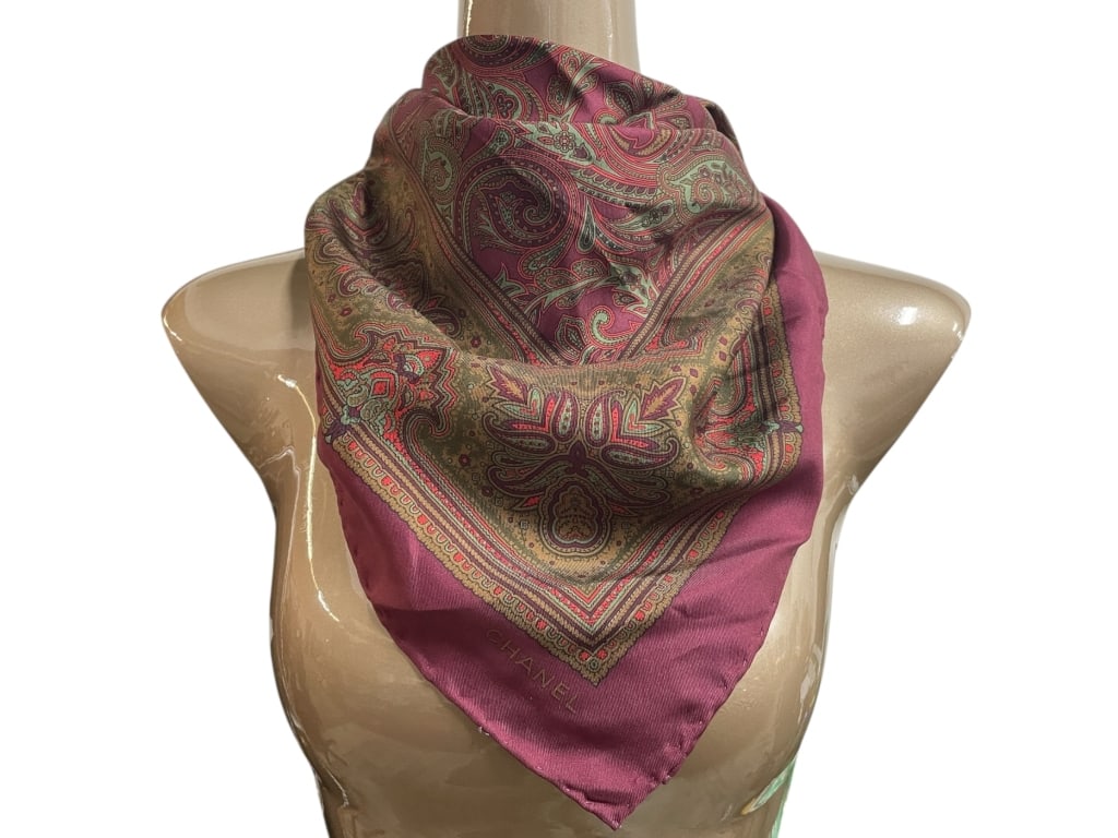 CHANEL BURGUNDY SILK SCARF W PAISLEY PATTERN 33": CHANEL BURGUNDY SILK SCARF WITH PAISLEY PATTERN -Very good pre owned condition -Approx 33" -Elegant Chanel silk scarf showcasing a rich paisley motif in shades of burgundy, olive, and soft gold. The i