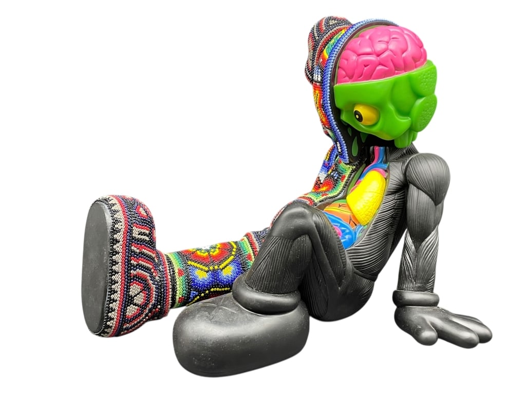 CHROMA HUICHOL BEADED RESTING IN PLACE 10": CHROMA HUICHOL BEADED RESTING IN PLACE - HUICHOL BEADED SKATEBOARDER FIGURE BY CHROMA. CONTEMPORARY STREET ART SCULPTURE INSPIRED BY THE ICONIC KAWS STYLE, COMPLETELY HAND-BEADED IN TRADITIONAL WIX?RI