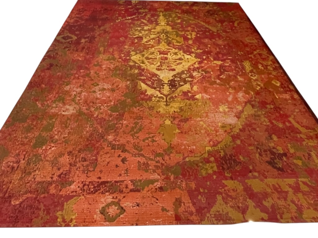 LIORA MANNE INDOOR / OUTDOOR AREA RUG 11 FT: LIORA MANNE CONTEMPORARY DISTRESSED STYLE INDOOR / OUTDOOR AREA RUG IN RED AND GOLD TONES -Liora Manne contemporary distressed-style indoor/outdoor area rug featuring layered red, gold, and earthy ton