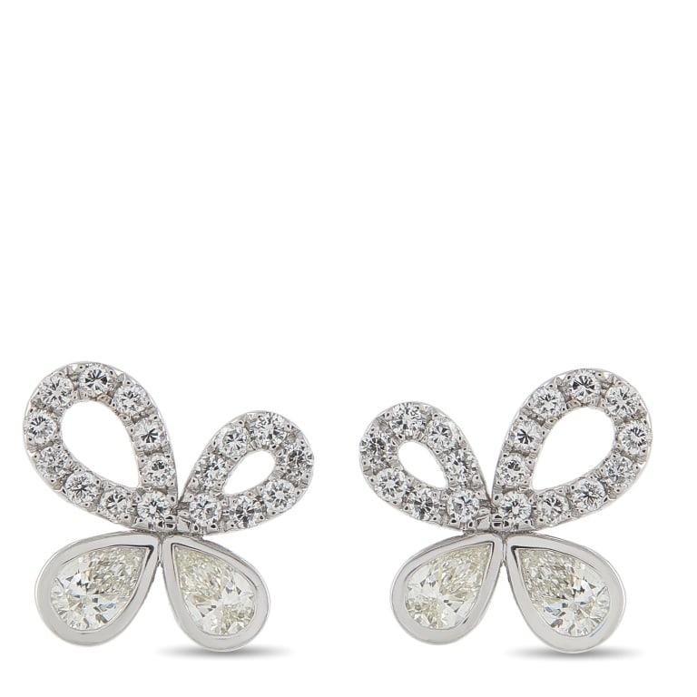 18K WHITE GOLD 1.85CT DIAMOND FLOWER EARRINGS: A playfully imperfect bloom, these flower earrings emphasize the asymmetry as intentional and charming. The studs in 18K white gold shine with a total of 1.85 carats of diamonds. Each earring