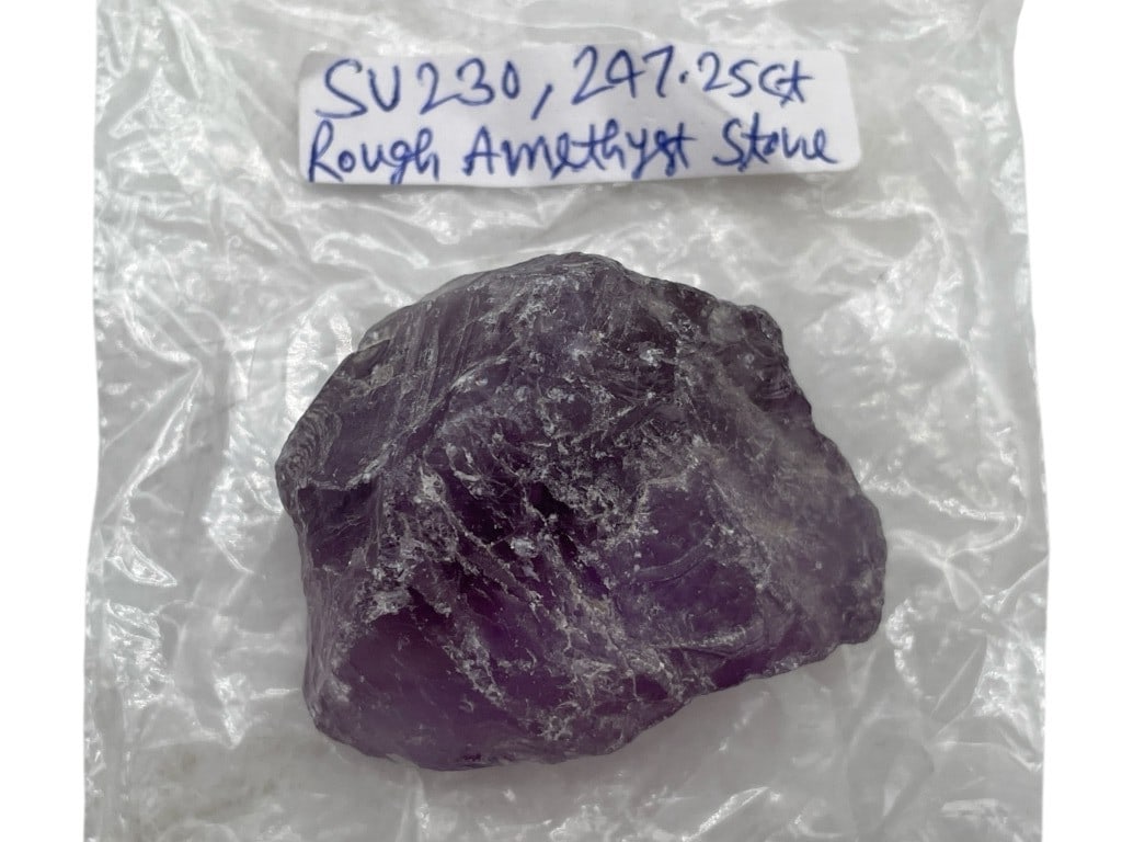 LARGE ROUGH AMETHYST STONE APPROX 247.25 CARATS: LARGE ROUGH AMETHYST STONE APPROX 247.25 CARATS-Substantial natural rough amethyst specimen weighing approximately 247.25 carats. This uncut stone displays rich purple coloration with lighter