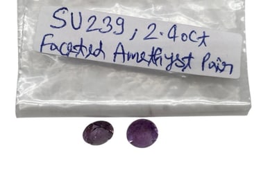 FACETED AMETHYST PAIR TOTALING APPROX 2.40 CARATS
