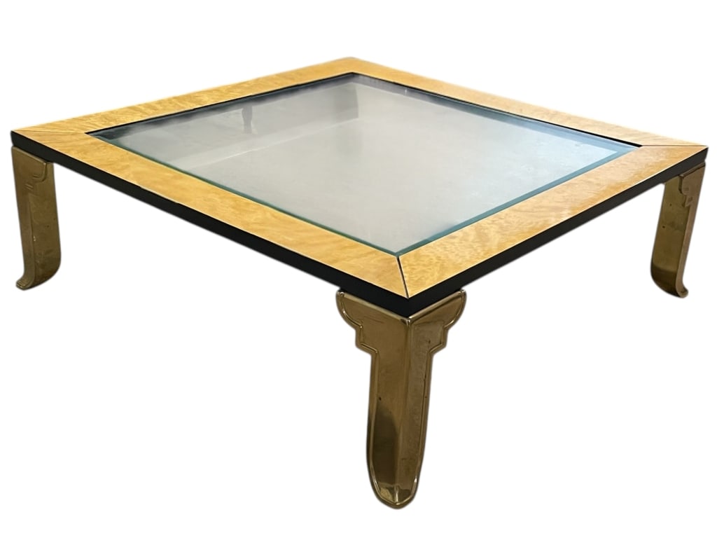 HOLLYWOOD REGENCY BURLWOOD & BRASS COFFEE TABLE: HOLLYWOOD REGENCY STYLE SQUARE COFFEE TABLE WITH BRASS LEGS AND GLASS TOP -This striking Hollywood Regency coffee table features a sleek square design with an inset glass top framed by a blonde burlwo