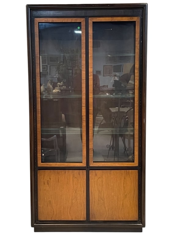 MID-CENTURY STYLE WOOD AND BLACK LACQUER CABINET: MID-CENTURY STYLE WOOD AND BLACK LACQUER DISPLAY CABINET WITH GLASS DOORS AND STORAGE. -Substantial and well-proportioned cabinet featuring a black lacquered frame with warm wood panel accents, upper