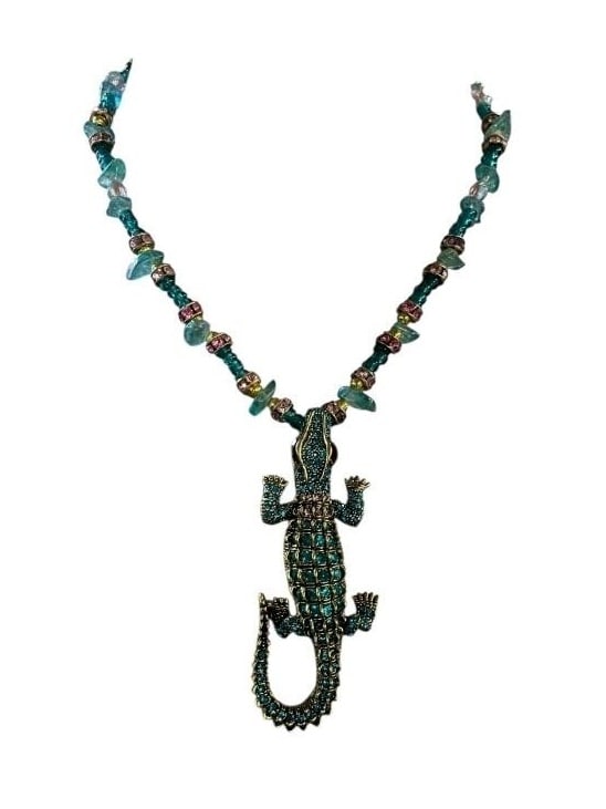ARTISAN BEADED TURQUOISE PINK ALLIGATOR NECKLACE: - Gorgeous in pink and turquoise bling on the gator - Pink and blue toned beads in glass and natural chips added - Artisan made and never worn - Gold tone accents - Measures 18" in total length msn By