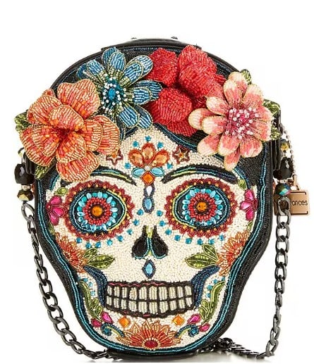Mary Frances Bella Noche Crossbody Handbag: Meet Bella Noche a bold blend of tradition and unapologetic flair. Adorned with vivid florals, radiant beadwork, and a striking sugar skull silhouette, this handbag isn’t for the faint of fashion. I