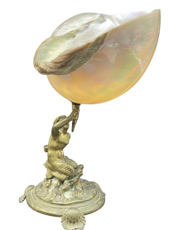 TIFFANY STYLE MERMAID W NAUTILUS SHELL BRONZE 9": TIFFANY STYLE MERMAID HOLDING NAUTILUS SHELL BRONZE -TIFFANY STYLE MERMAID HOLDING NAUTILUS SHELL BRONZE SCULPTURAL LAMP OR DECORATIVE OBJECTDecorative Tiffany-style sculptural piece featuring a cast