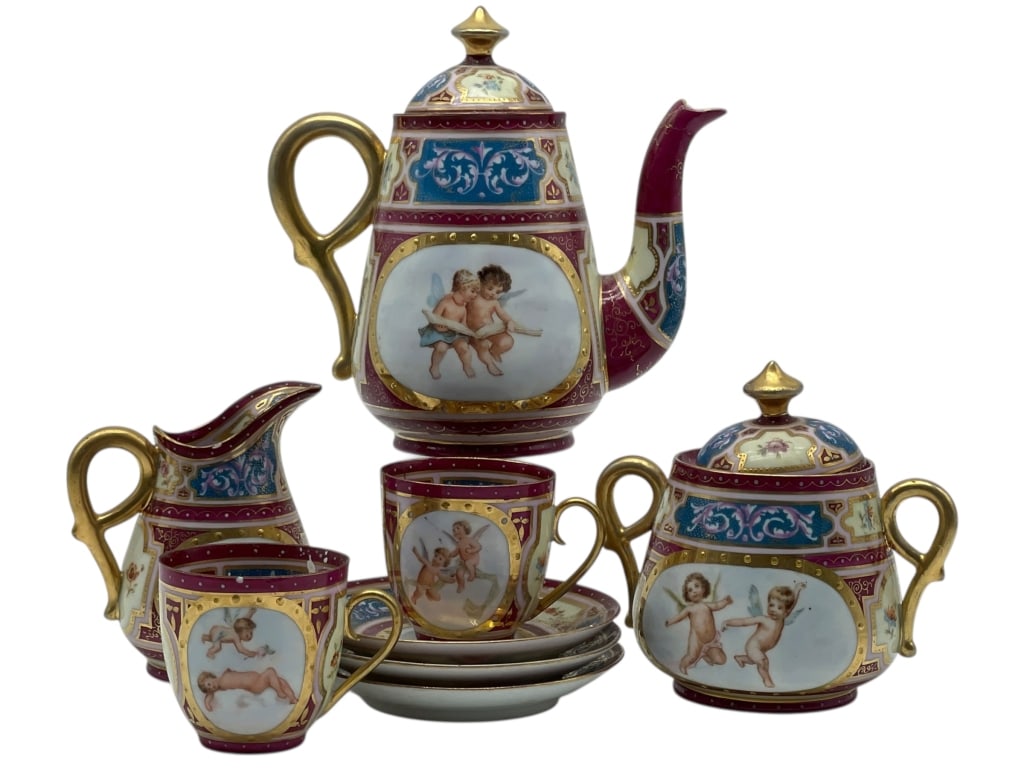 ANTIQUE VIENNA AUSTRIA TEA SET: ANTIQUE VIENNA AUSTRIA TEA SET -An elegant vintage porcelain tea service featuring a rich burgundy ground heavily accented with gilded scrollwork and Neoclassical motifs. Each primary piece is adorned
