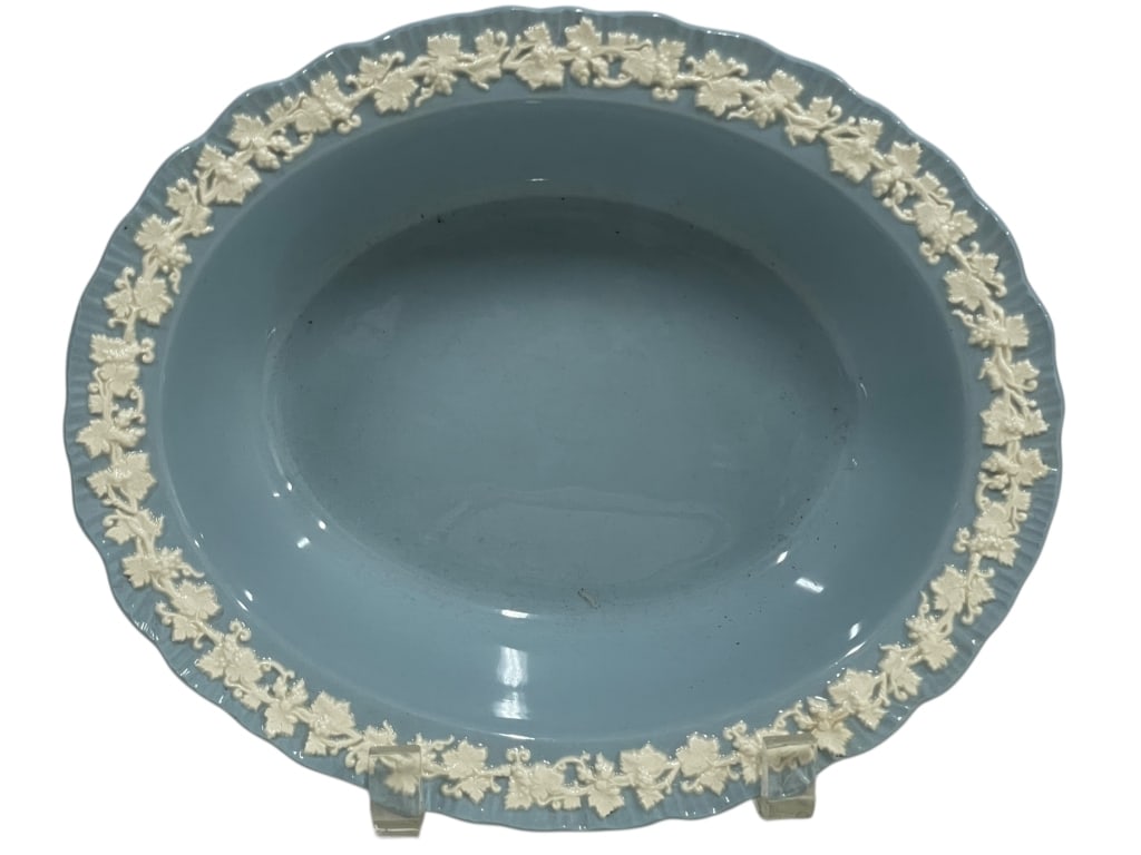 WEDGWOOD EMBOSSED QUEENSWARE OVAL DISH 11": VINTAGE WEDGWOOD EMBOSSED QUEENSWARE OVAL DISH -This elegant vintage Wedgwood Queensware oval celery or serving dish features a soft blue glaze adorned with an intricate white embossed grapevine borde