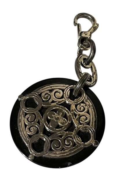 VINTAGE BRIGHTON CONTEMPO MEDALLION KEY FOB DANGLE: - Vintage and showing some light signs of patina - Brighton Contempo - Medallion on black backing with key fob clip - Approximately 4" long - Good condition! msn By bidding on this listing, you unders