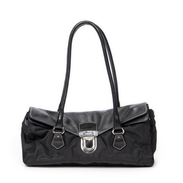 PRADA PUSHLOCK FLAP BAG NYLON CANVAS: *For ALTERNATIVE SHIPPING QUOTES, please visit www.dejavuauctionshipping.com* Prada Pushlock Flap Bag Nylon Canvas * COLOR: Black * PRODUCTION CODE: 10/113 * INCLUDED: 30*18*7.5cm * CONDITION: A * (3c