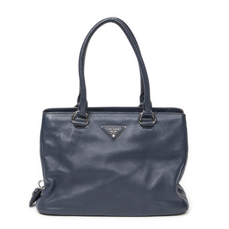 PRADA NAVY CONVERTIBLE ZIP AROUND TOTE: *For ALTERNATIVE SHIPPING QUOTES, please visit www.dejavuauctionshipping.com* Prada Convertible Zip Around Tote Navy Grained Calfskin Leather Silver * COLOR: Navy * PRODUCTION CODE: 31/Z * INCLUDED: "