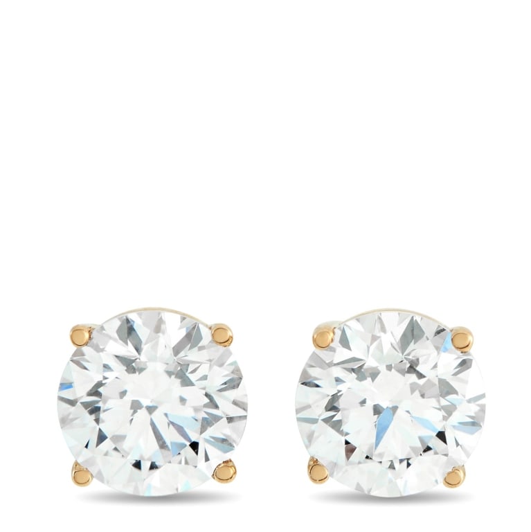 14K YELLOW GOLD 2.05CT LAB DIAMOND STUD EARRINGS: Petite earrings with a clear, bright finish. Each round brilliant lab-grown diamond (VVS-VS) sits in a 14K yellow gold four-prong basket. At 0.25 inches each, they stay minimal on the ear while delive