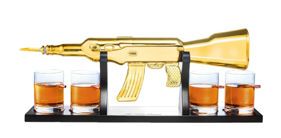 NEW IN BOX! AK 47 GUN DECANTER SET: DRINKING WHISKEY WILL NEVER BE THE SAME: Gold AK Decanter & 4 whiskey glasses paired with a wooden display stand. Can you imagine how classy this will look in your bar? This handmade rifle whiskey dec