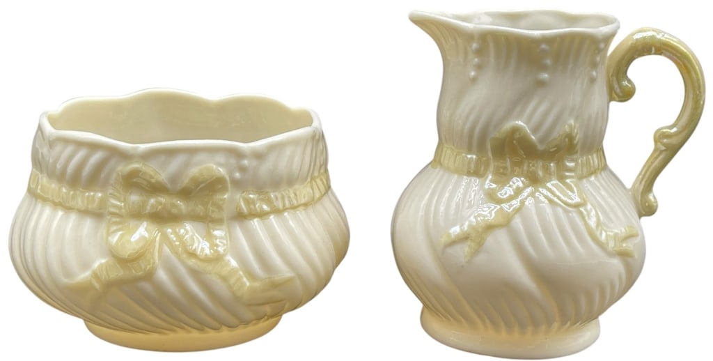BELLEEK IRELAND FINE PARIAN CHINA CREAMER & SUGAR: BELLEEK IRELAND FINE PARIAN CHINA CREAMER & SUGAR SET THIS ELEGANT TWO-PIECE ESTATE SET FROM THE CELEBRATED BELLEEK IRELAND POTTERY FEATURES A CREAMER AND AN OPEN SUGAR BOWL CRAFTED FROM THEIR SIGNATU
