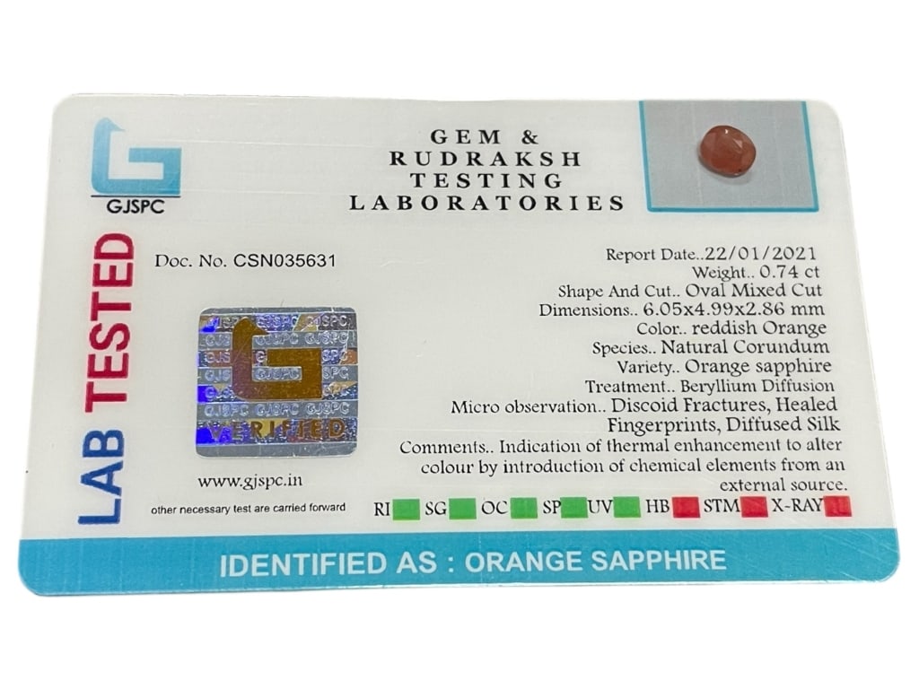 NATURAL ORANGE SAPPHIRE, 0.74 CT OVAL MIXED CUT: LAB-CERTIFIED NATURAL ORANGE SAPPHIRE, 0.74 CT OVAL MIXED CUT -This lab-tested natural orange sapphire weighs approximately 0.74 carats and is cut in an oval mixed cut, measuring approximately 6.05 x